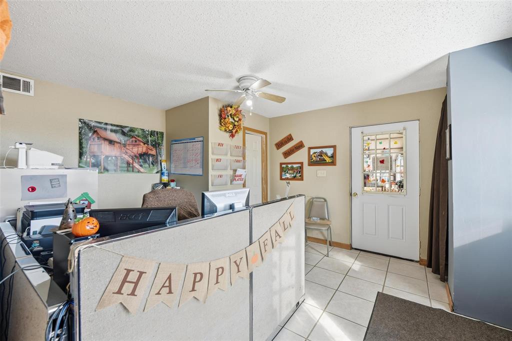 9510 Swafford Road Justin, TX 76247 - Photo 22 of 28 a bedroom with furniture and a baby crib