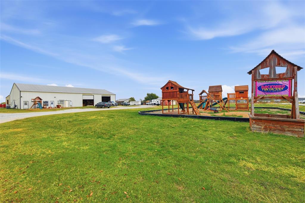 9510 Swafford Road Justin, TX 76247 - Photo 26 of 28 a view of a house with a back yard