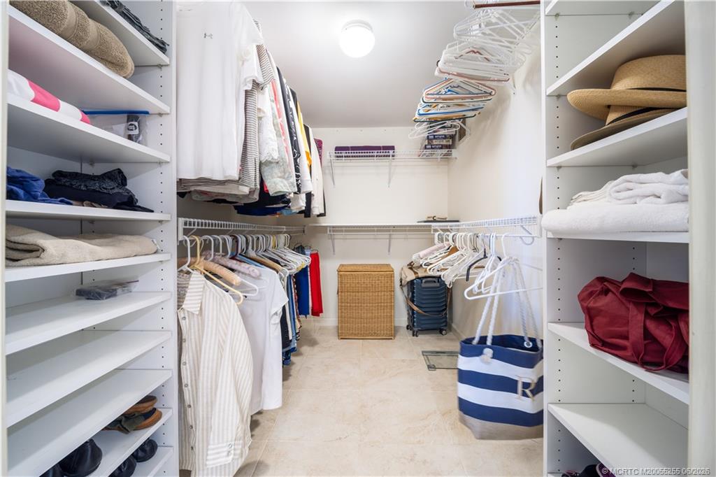 3100 Southeast Pruitt Road, Unit F101 Port St. Lucie, FL 34952 - Photo 23 of 37 Walk-in closet across from vanity