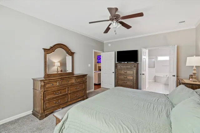 a bed room with a bed and a television