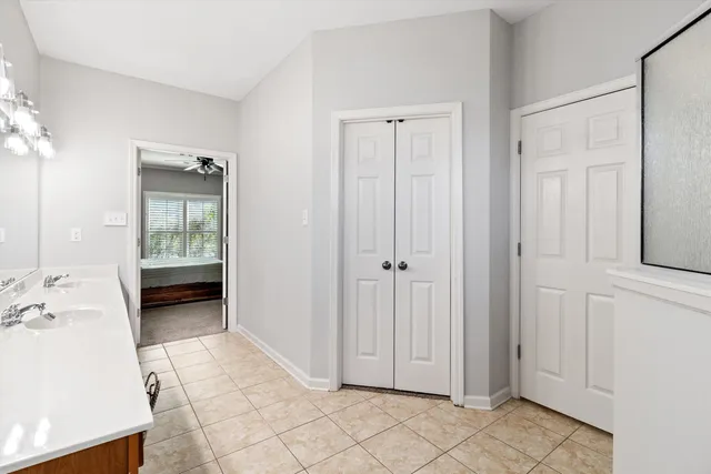 a view of an entryway with wooden floor and cabinet