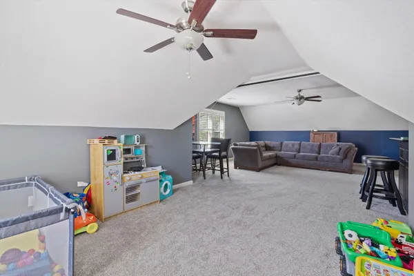 a view of a livingroom with an empty space & a flat screen tv