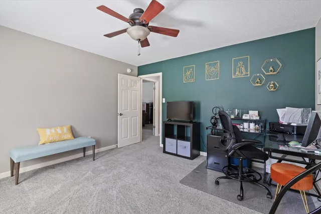 a view of a livingroom with workspace