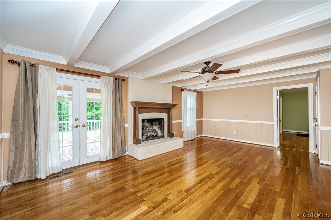 22508 Carson Road Dinwiddie, VA 23841 - Photo 12 of 50 a view of an empty room with wooden floor fireplace and a window