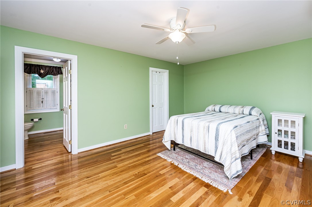 22508 Carson Road Dinwiddie, VA 23841 - Photo 15 of 50 a spacious bedroom with a bed and a chandelier
