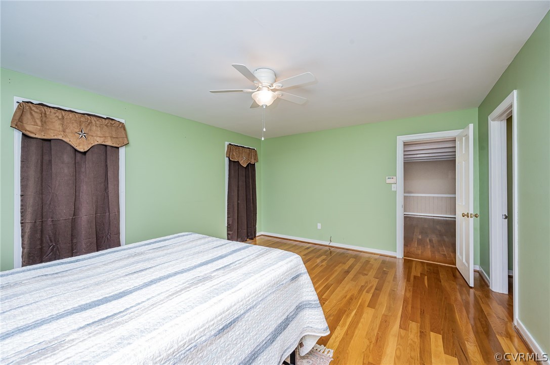 22508 Carson Road Dinwiddie, VA 23841 - Photo 16 of 50 a bedroom with a bed and a chandelier