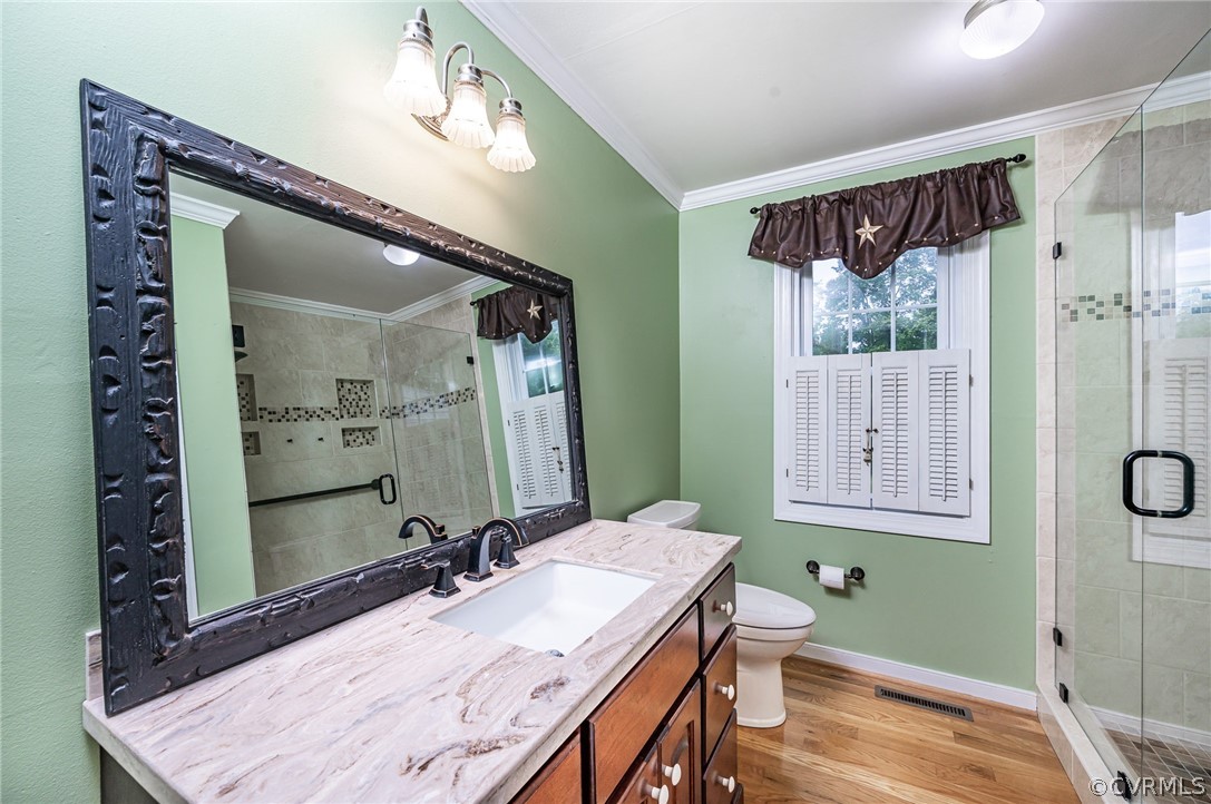 22508 Carson Road Dinwiddie, VA 23841 - Photo 17 of 50 a bathroom with a sink a mirror and a shower
