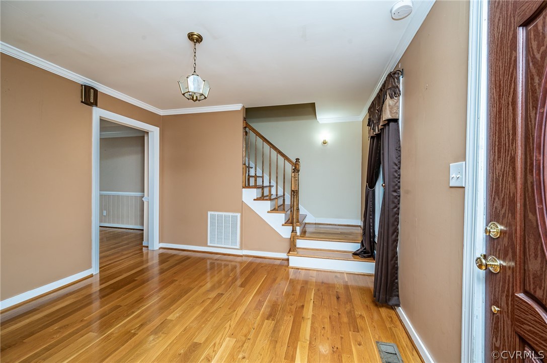 22508 Carson Road Dinwiddie, VA 23841 - Photo 2 of 50 a view of a hallway view with wooden floor and staircase