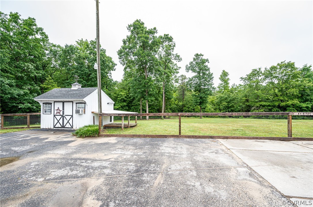 22508 Carson Road Dinwiddie, VA 23841 - Photo 32 of 50 a view of house with backyard and tree