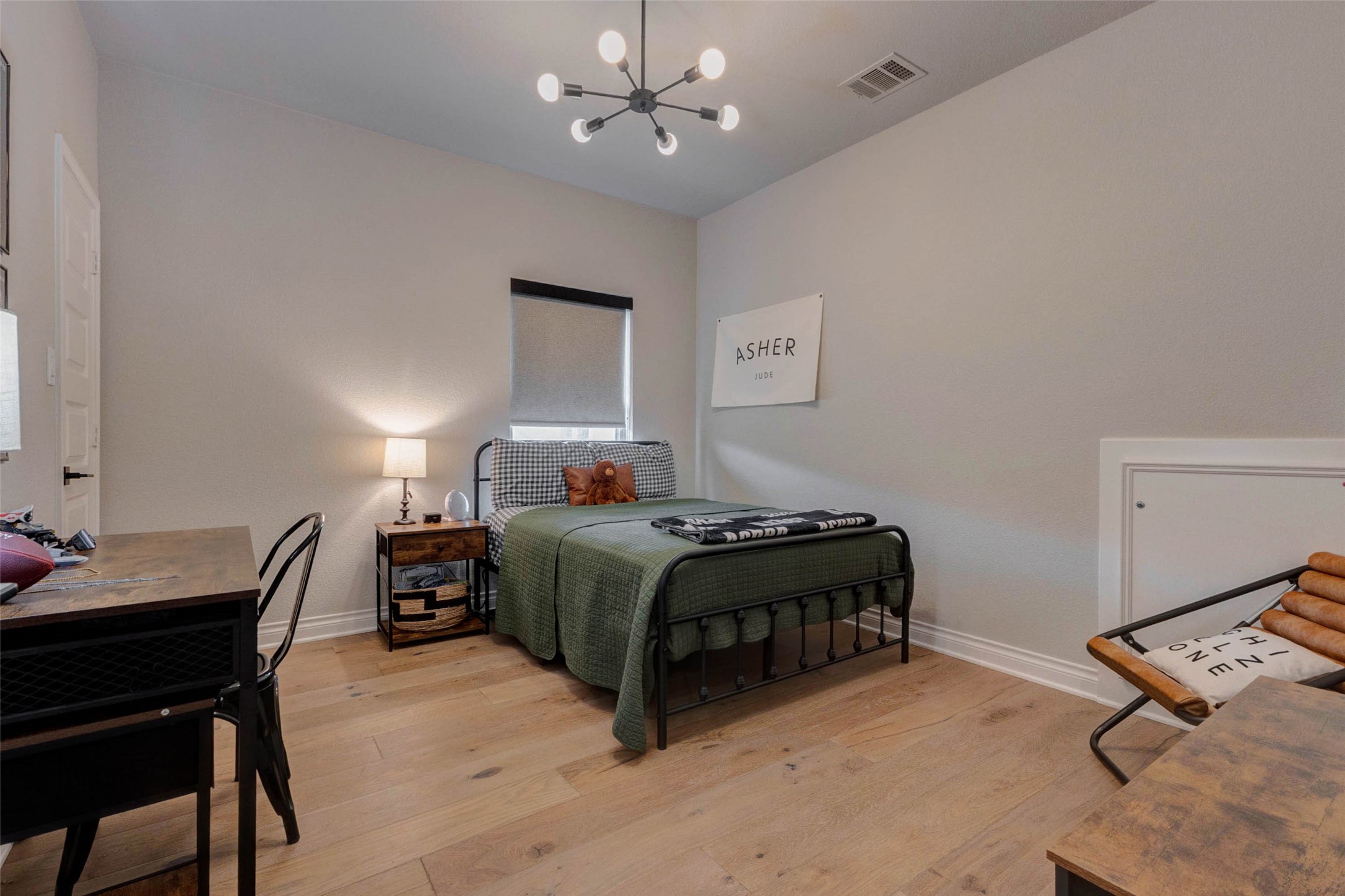 4303 Tupelo Leaf Court Manvel, TX 77578 - Photo 41 of 50 a bedroom with a bed a desk and chair