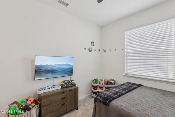 a bedroom with a bed and furniture