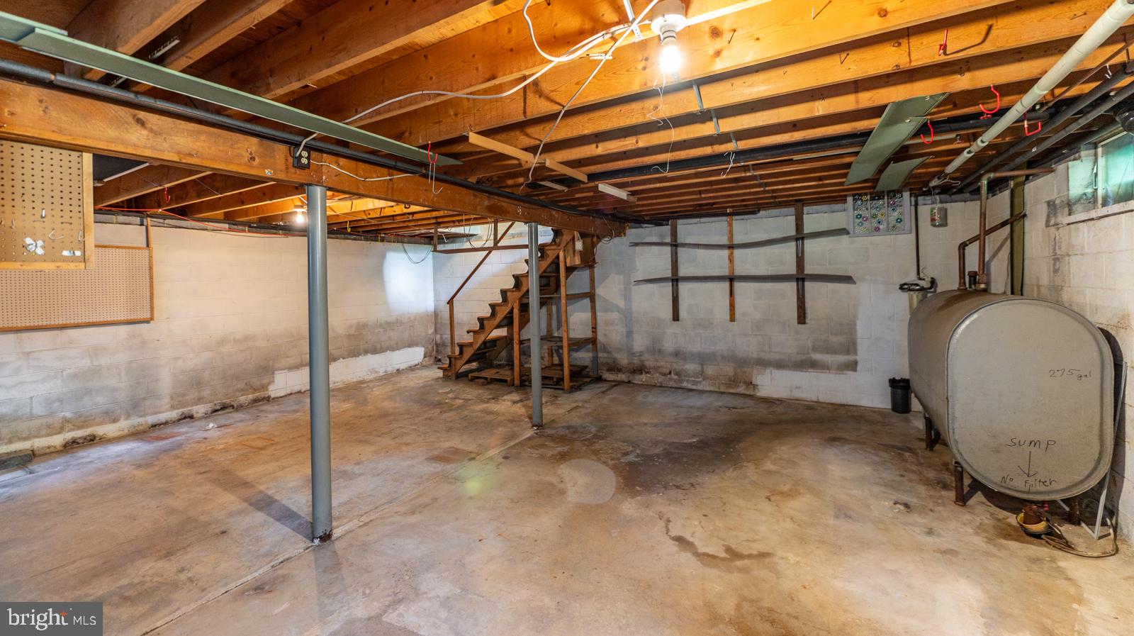 223 Trythall Road Elverson, PA 19520 - Photo 57 of 78 a view of a garage with wooden floor and iron stairs