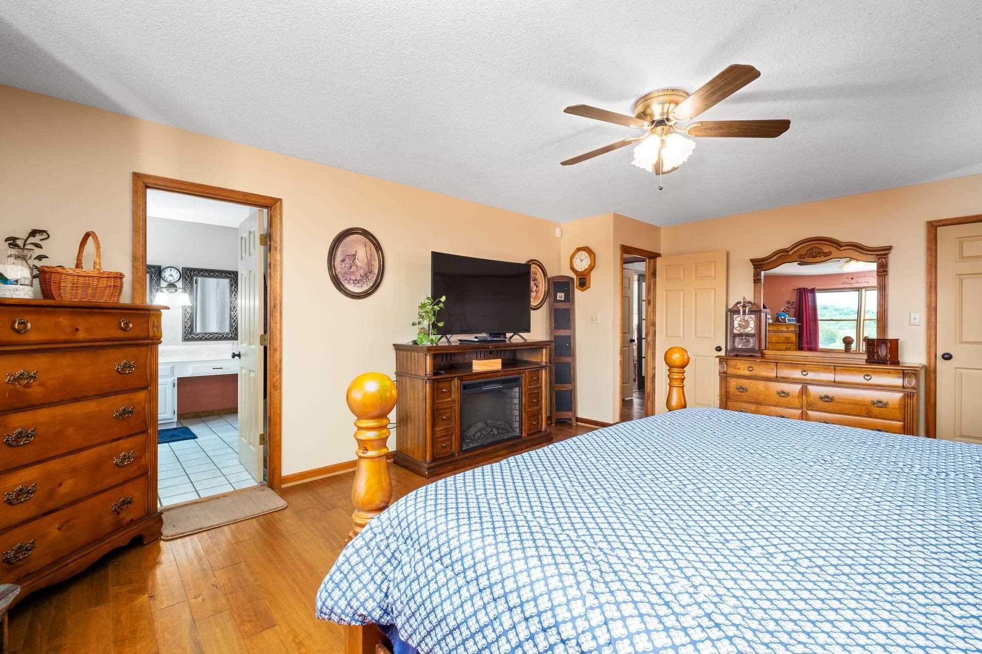 556 Buttermilk Spring Road Staunton, VA 24401 - Photo 24 of 67 a bedroom with a bed and wooden floor