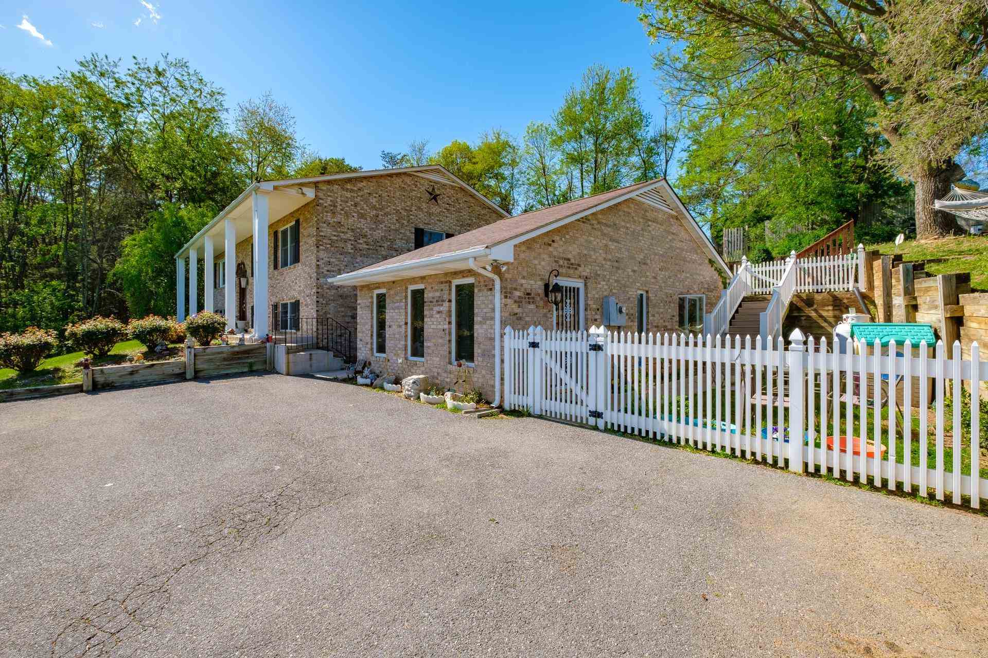 556 Buttermilk Spring Road Staunton, VA 24401 - Photo 49 of 67 a view of a house with a yard and deck