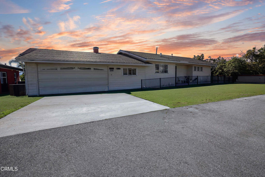 a front view of a house with garage