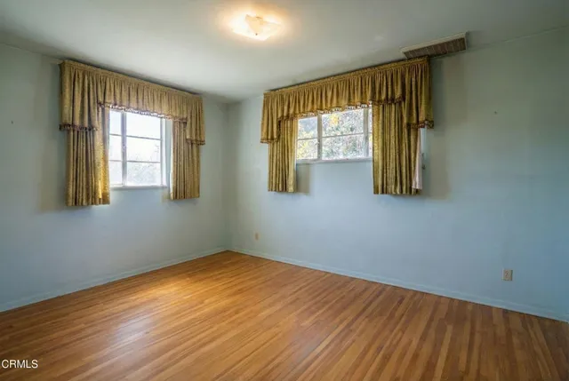 a white toilet sitting next to a bath tub