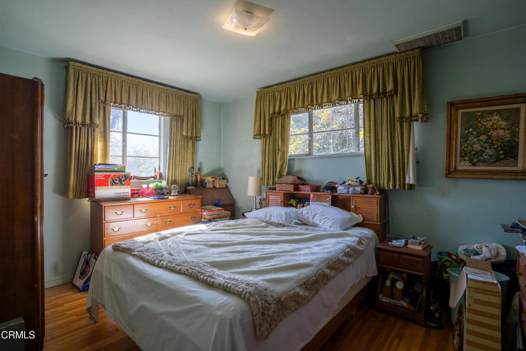 3208 Orange Drive Camarillo, CA 93010 - Photo 13 of 29 a bedroom with a bed and wooden floor