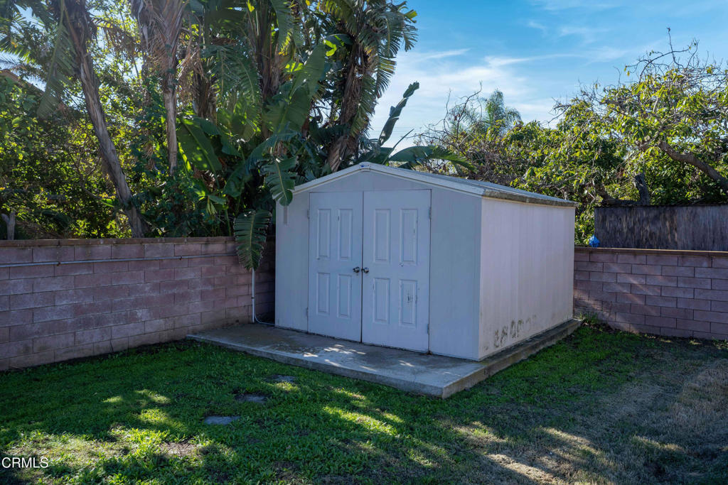 3208 Orange Drive Camarillo, CA 93010 - Photo 18 of 29 a view of a backyard with potted plants and wooden fence