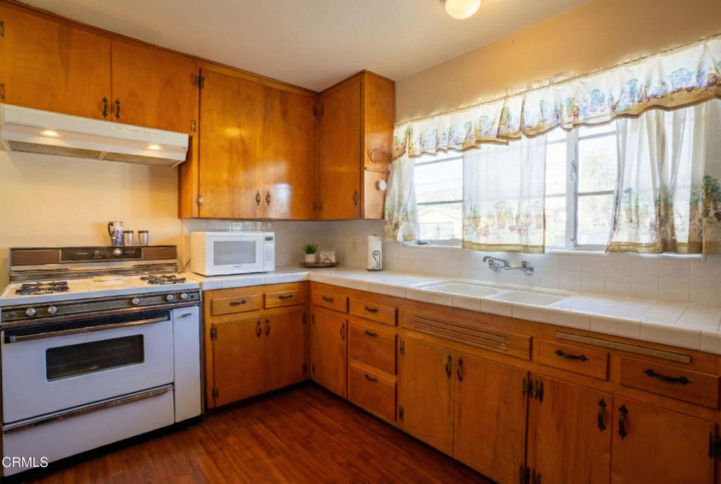 3208 Orange Drive Camarillo, CA 93010 - Photo 2 of 29 a kitchen with sink stove and cabinets