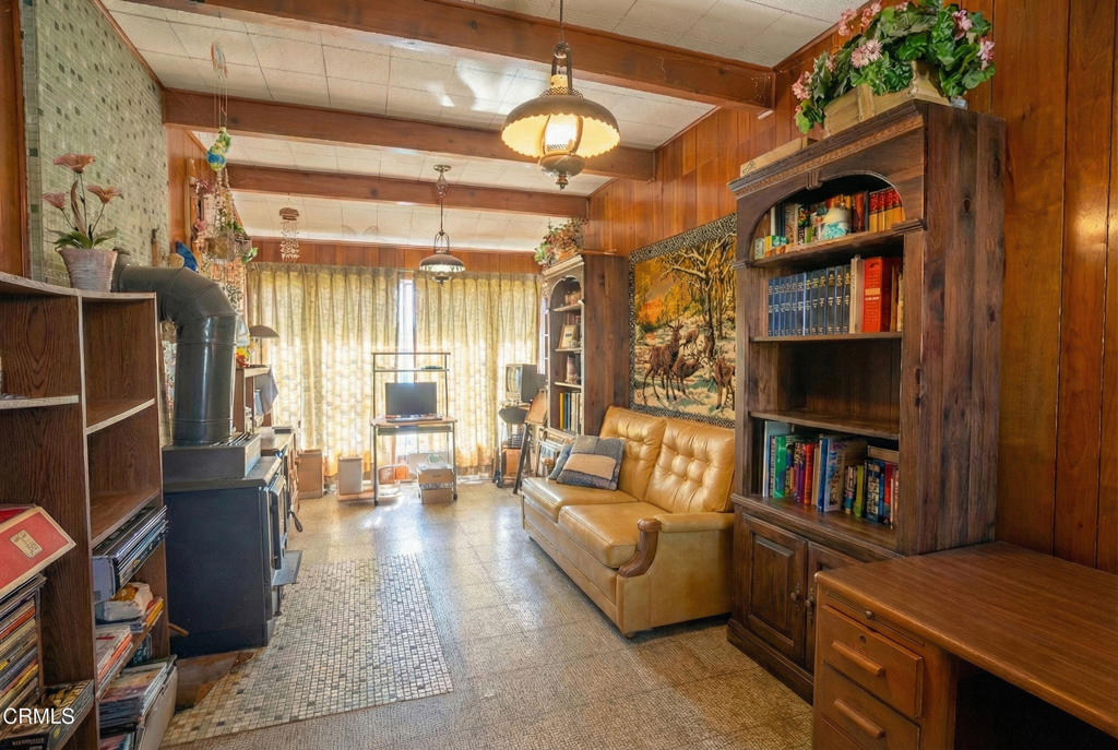 3208 Orange Drive Camarillo, CA 93010 - Photo 26 of 29 a living room with fireplace furniture and a book shelf