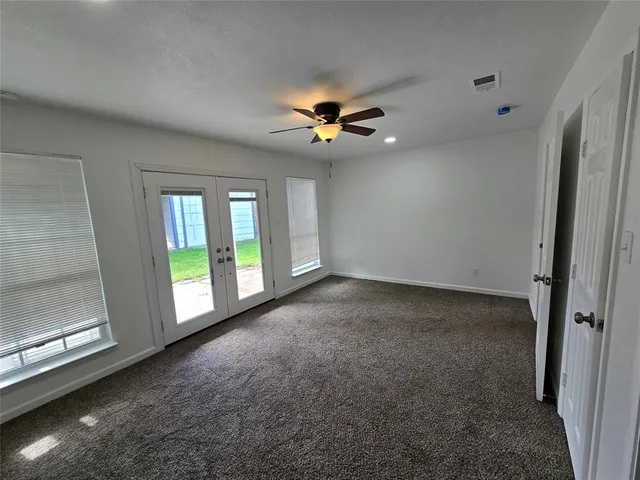 a view of empty room with windows