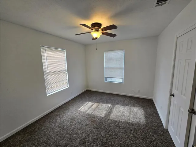 an empty room with a empty space and a window