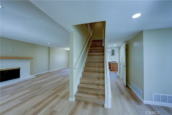 a view of entryway with wooden floor