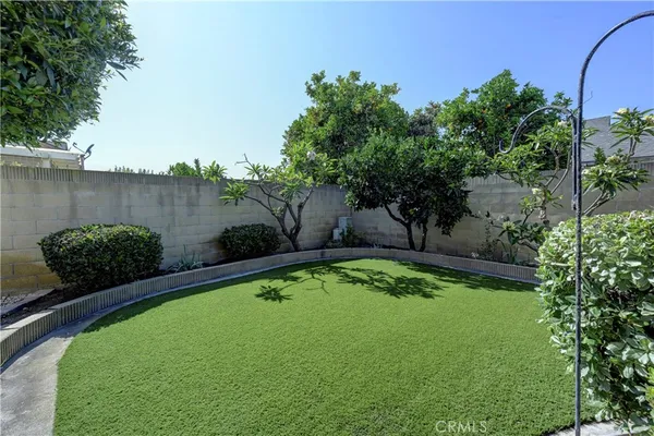 a view of a swimming pool with outdoor seating