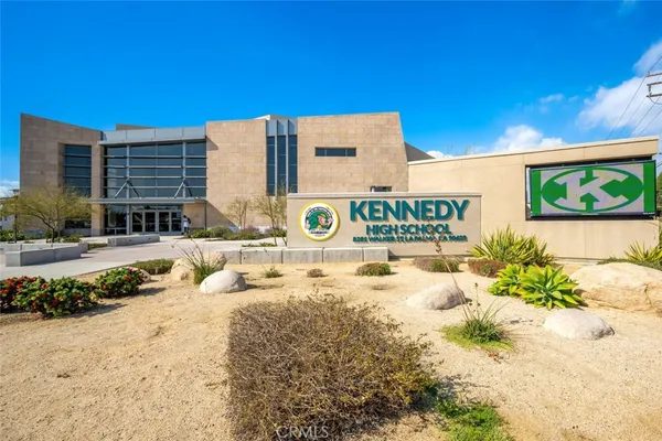 a view of a swimming pool with outdoor seating