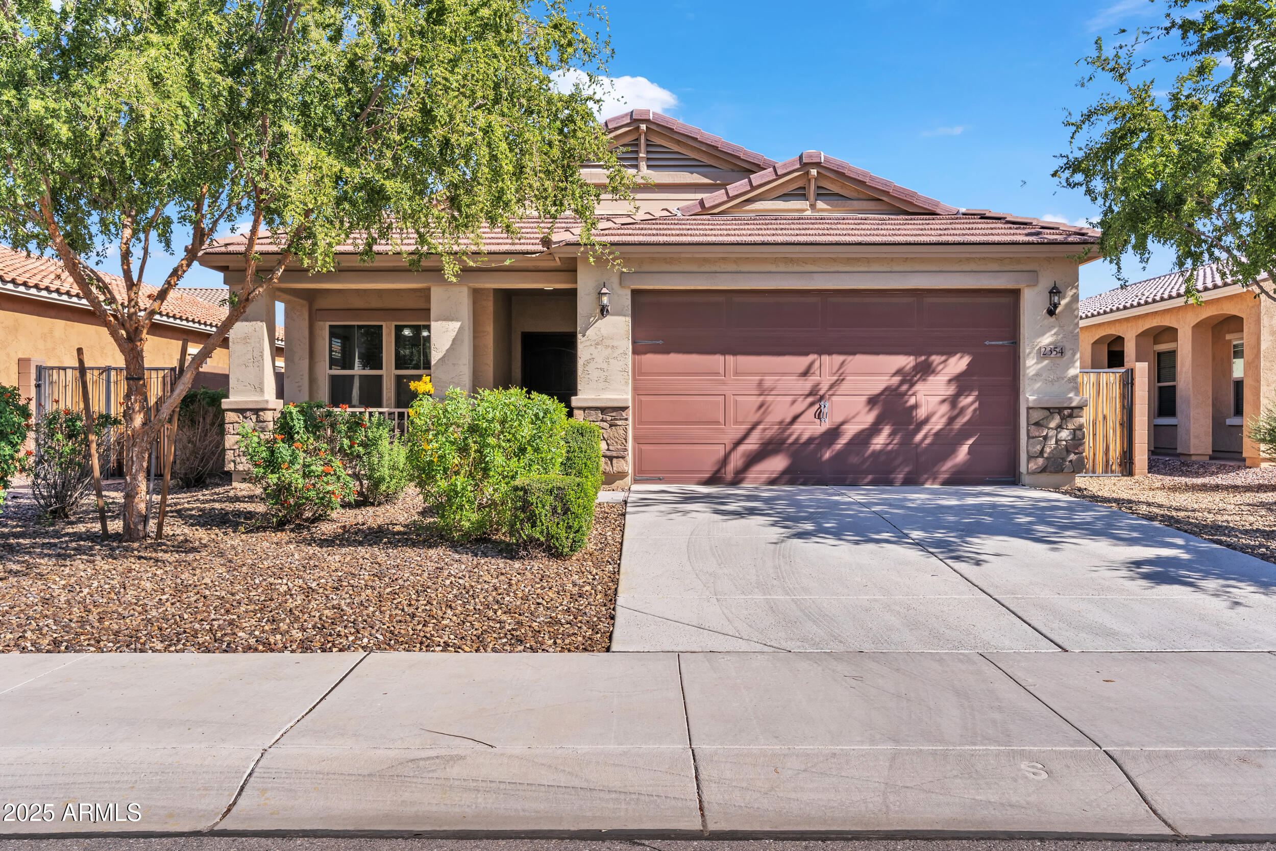 2354 East Bellerive Drive Gilbert, AZ 85298 - Photo 1 of 34 a front view of a house with a yard and garage