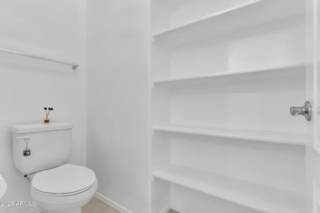 a view of small space with racks on the wall