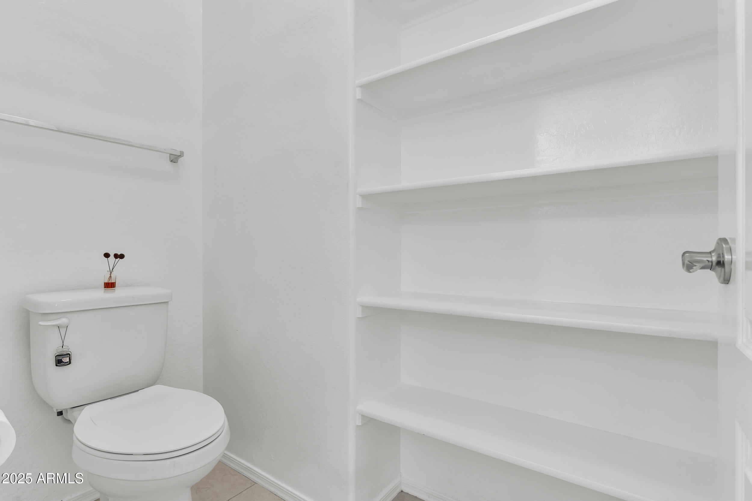 2354 East Bellerive Drive Gilbert, AZ 85298 - Photo 21 of 34 a white toilet sitting next to a bathroom sink