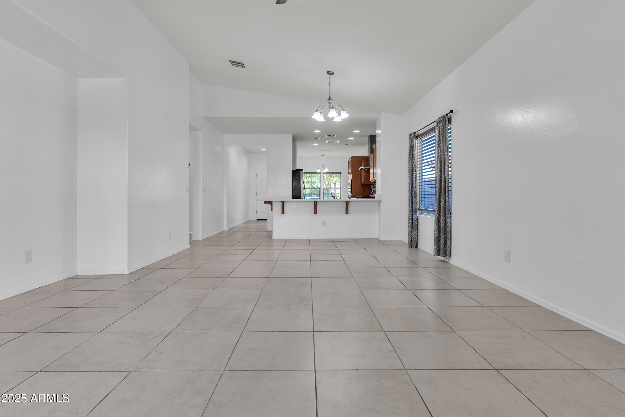 2354 East Bellerive Drive Gilbert, AZ 85298 - Photo 23 of 34 a view of a livingroom with furniture and chandelier