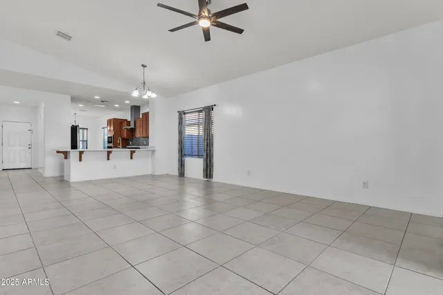 a view of a livingroom with furniture and chandelier
