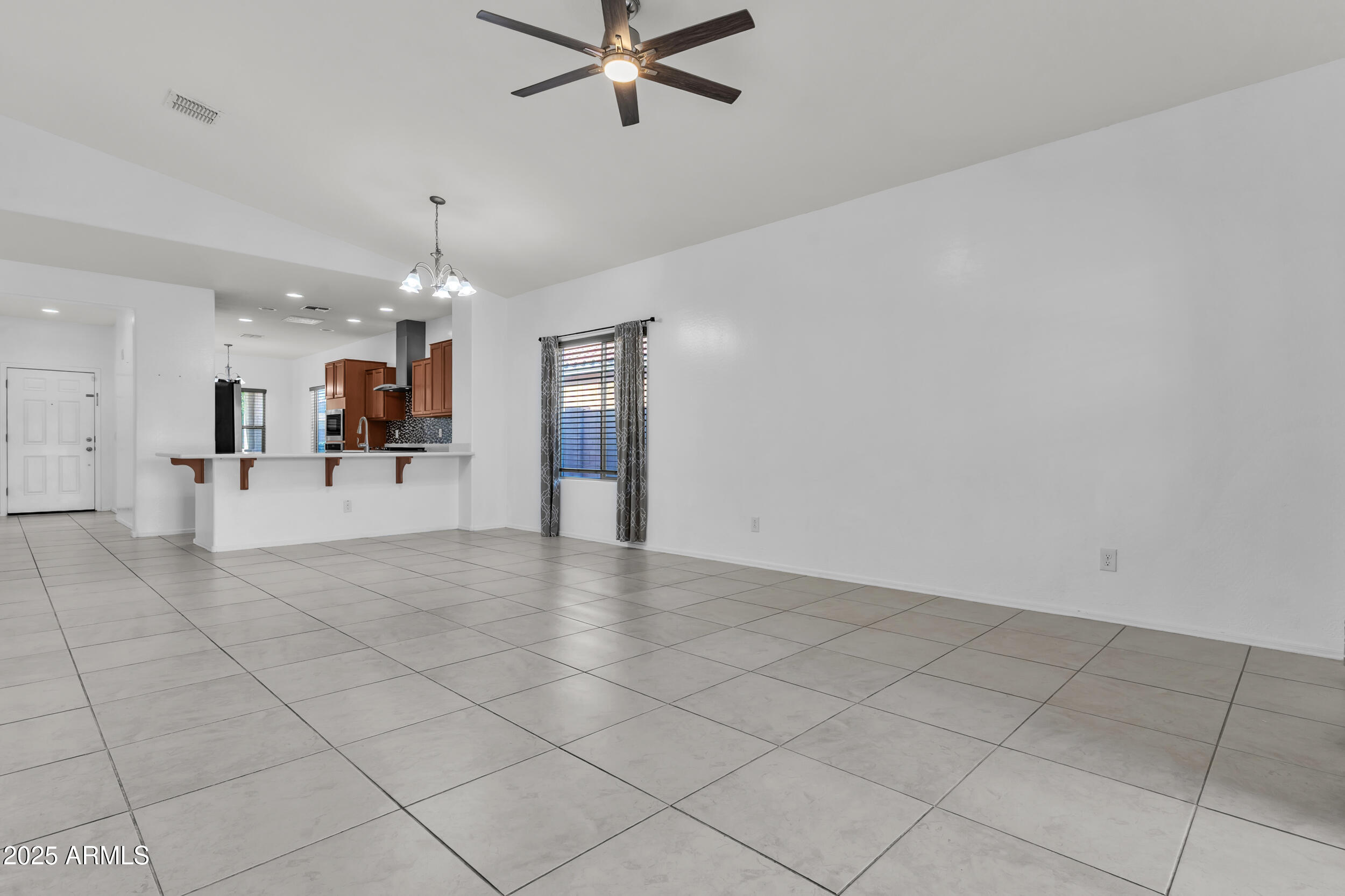 2354 East Bellerive Drive Gilbert, AZ 85298 - Photo 24 of 34 a view of a livingroom with furniture and a kitchen view