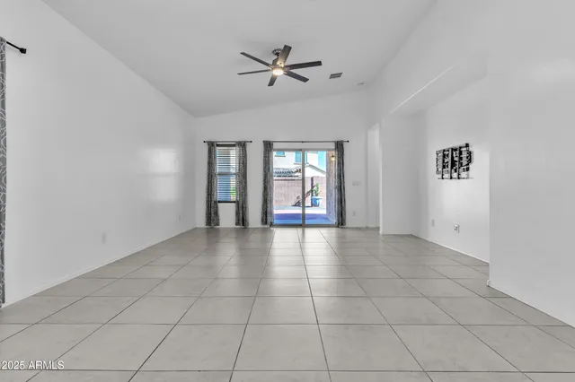 a front view of a house with a yard and a garage