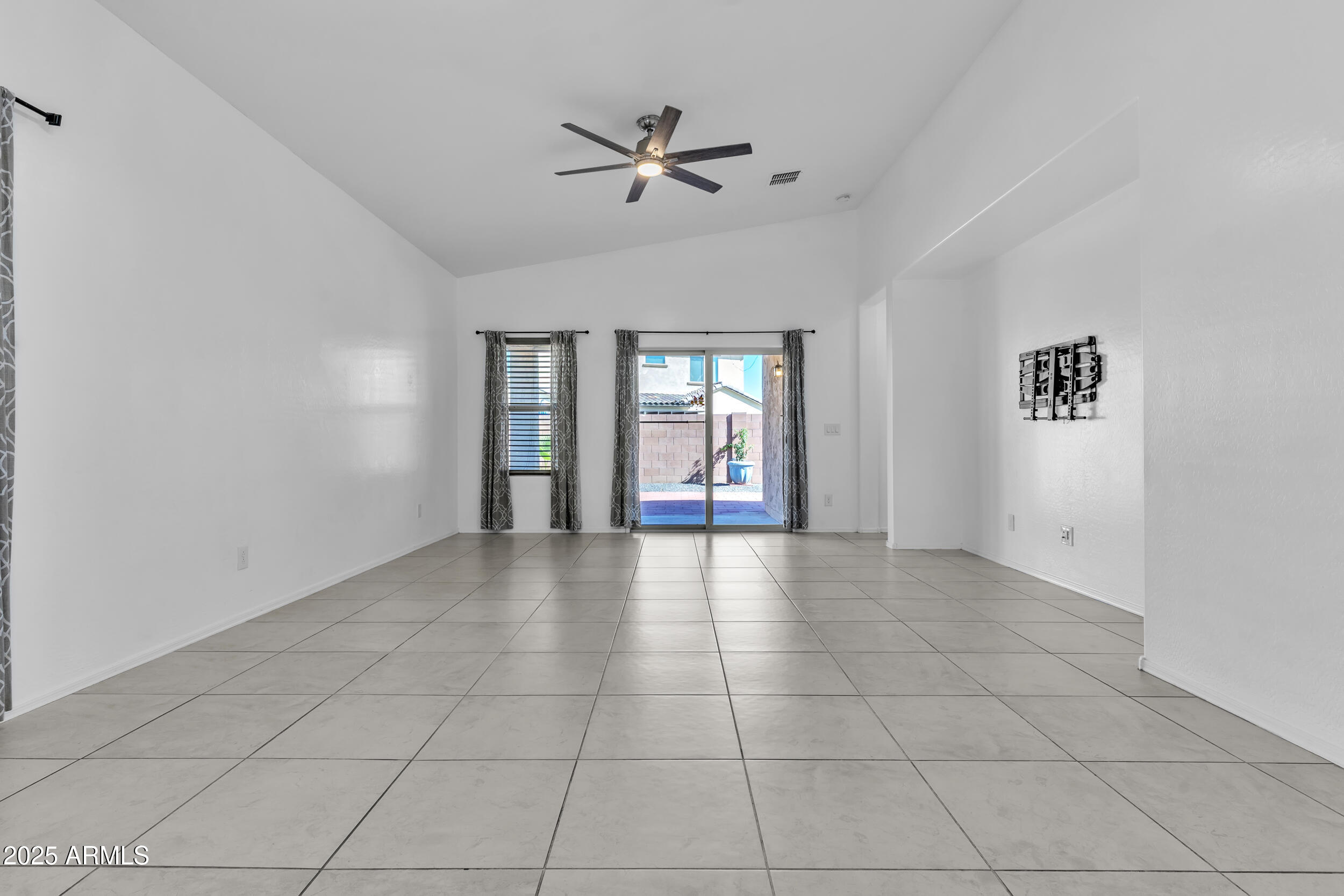 2354 East Bellerive Drive Gilbert, AZ 85298 - Photo 3 of 34 a view of an empty room with a window