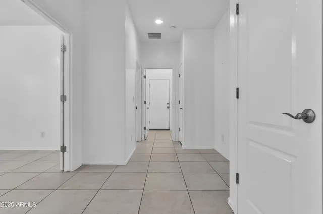 a kitchen with a refrigerator and a sink