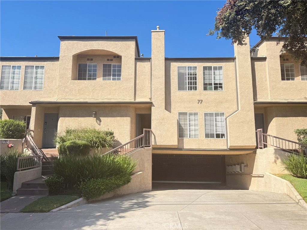 77 North Michigan Avenue, Unit 3 Pasadena, CA 91106 - Photo 3 of 11 a front view of a house with a yard