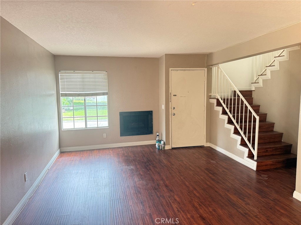 77 North Michigan Avenue, Unit 3 Pasadena, CA 91106 - Photo 5 of 11 a view of an empty room with wooden floor and a window