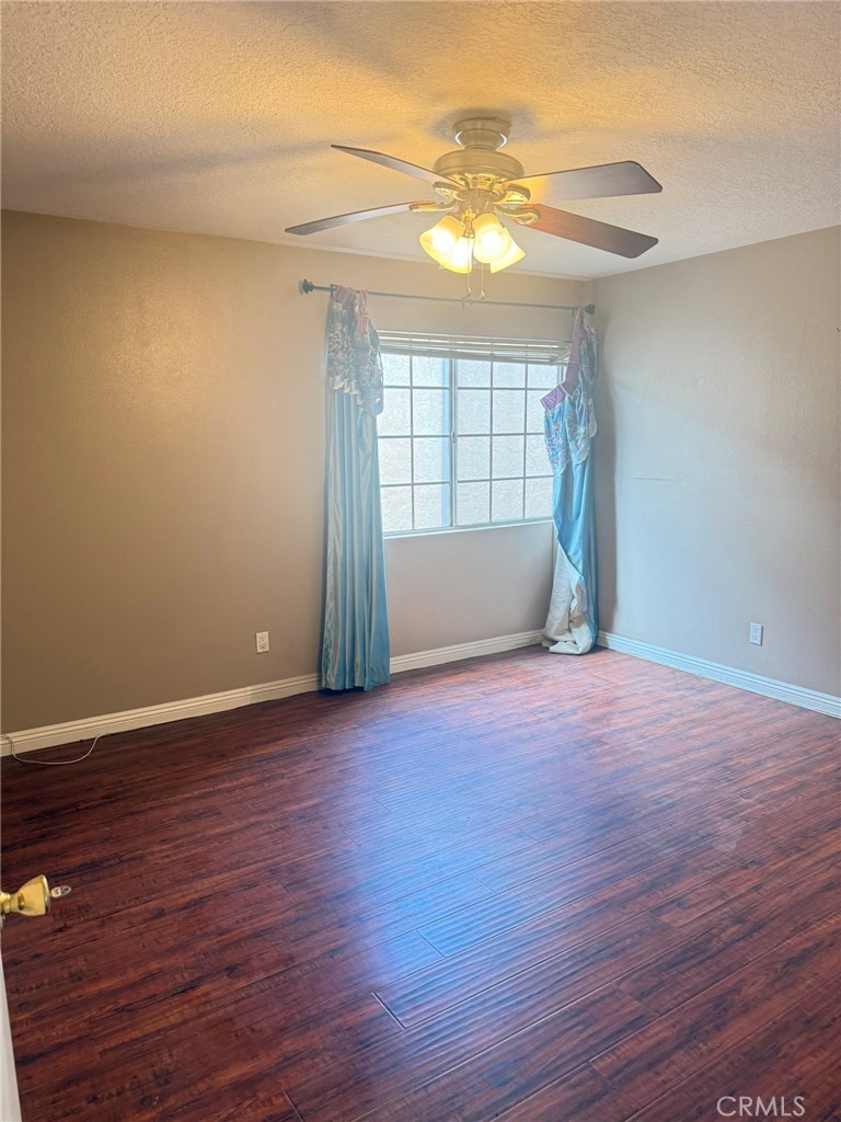 77 North Michigan Avenue, Unit 3 Pasadena, CA 91106 - Photo 10 of 11 a view of an empty room with wooden floor and a window