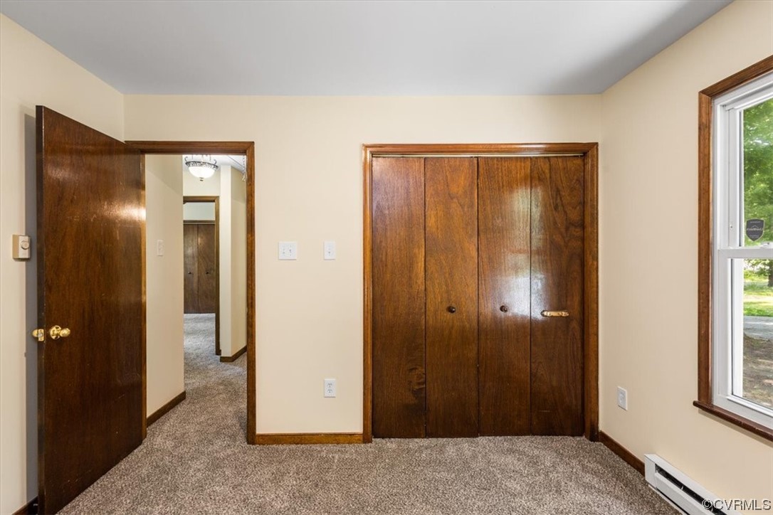 10712 Genlou Road Chesterfield, VA 23832 - Photo 28 of 43 a view of a hallway with wooden floor and closet area