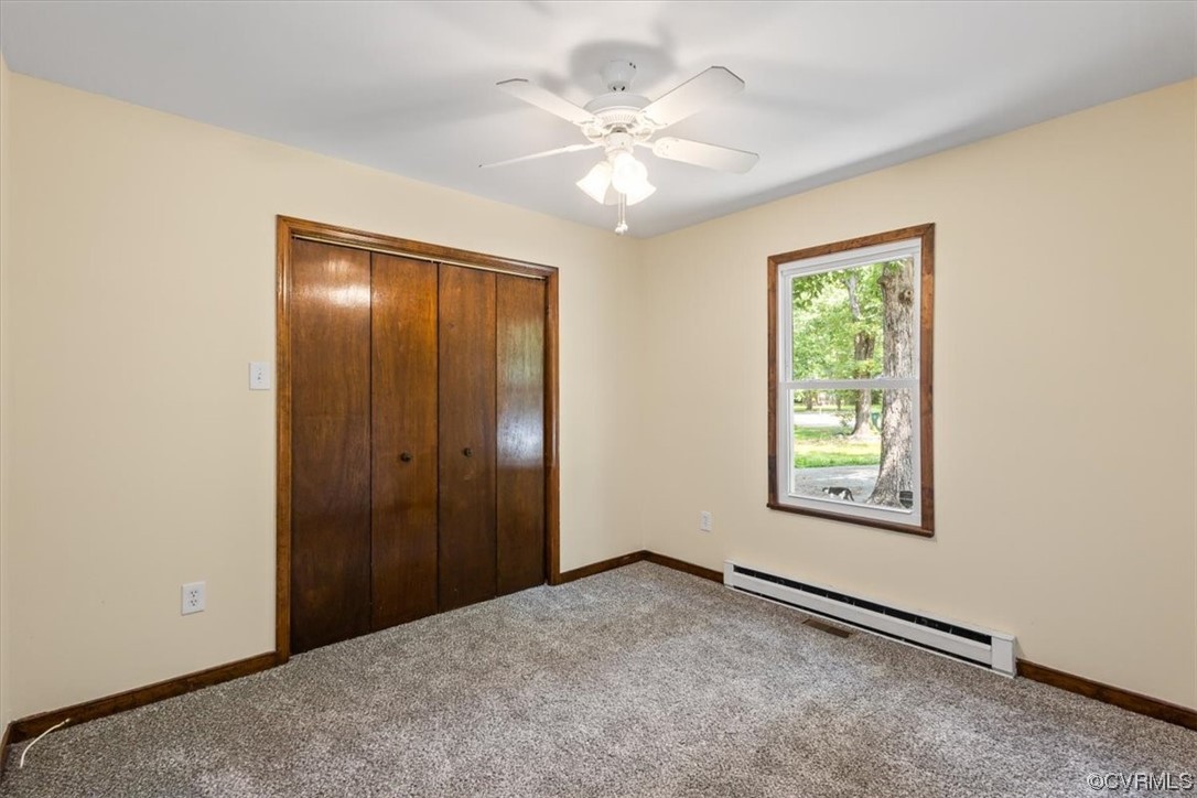 10712 Genlou Road Chesterfield, VA 23832 - Photo 39 of 43 an empty room with windows and closet