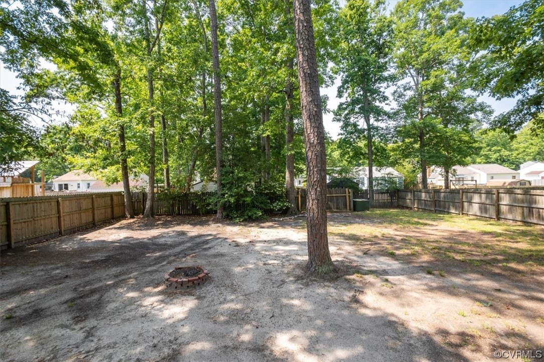 10712 Genlou Road Chesterfield, VA 23832 - Photo 9 of 43 a view of a yard with plants and trees