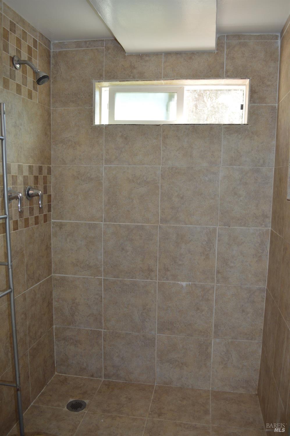 3525 Madrone Street Clearlake, CA 95422 - Photo 8 of 13 a bathroom with a shower