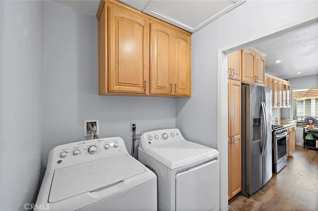 a view of storage and utility room with washer and dryer