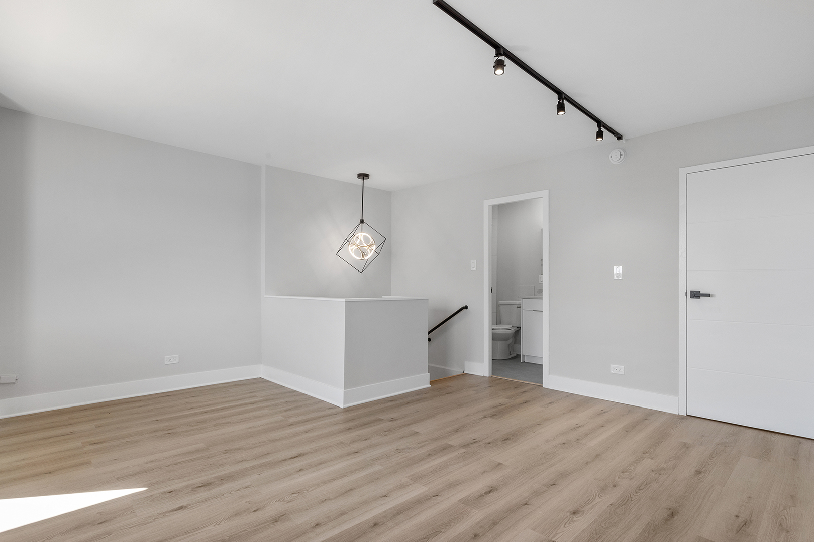 6166 North Sheridan Road, Unit 22F Chicago, IL 60660 - Photo 9 of 22 wooden floor in an empty room with a window