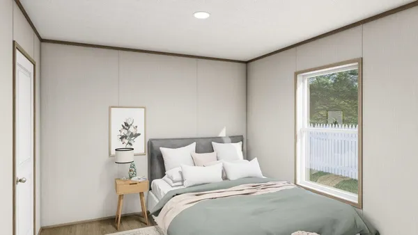 a bed room with a bed and a painting