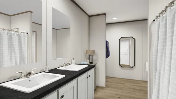 a bathroom with a double vanity sink and a mirror