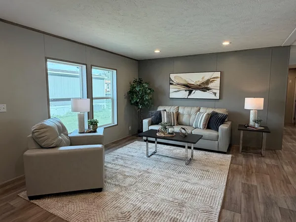 a living room with furniture and a large window